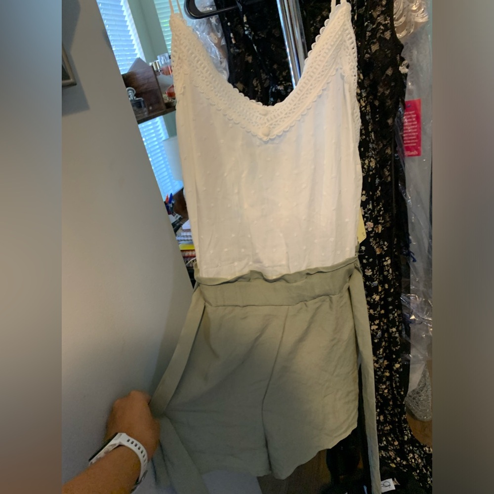 Cute summer romper with pockets and bow to tie in the back!